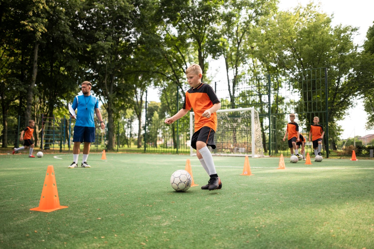 football-trainer-teaching-his-pupils